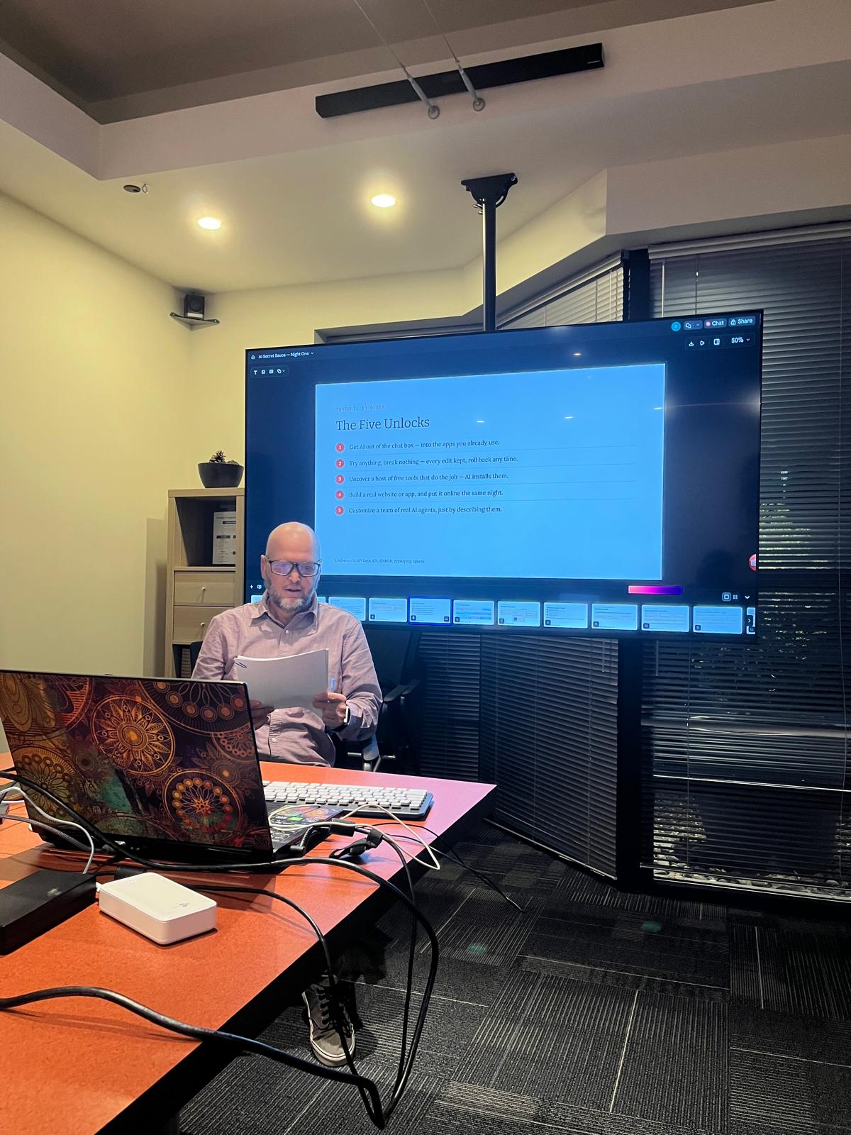 The Five Unlocks slide on the big screen at Cowork Chilliwack